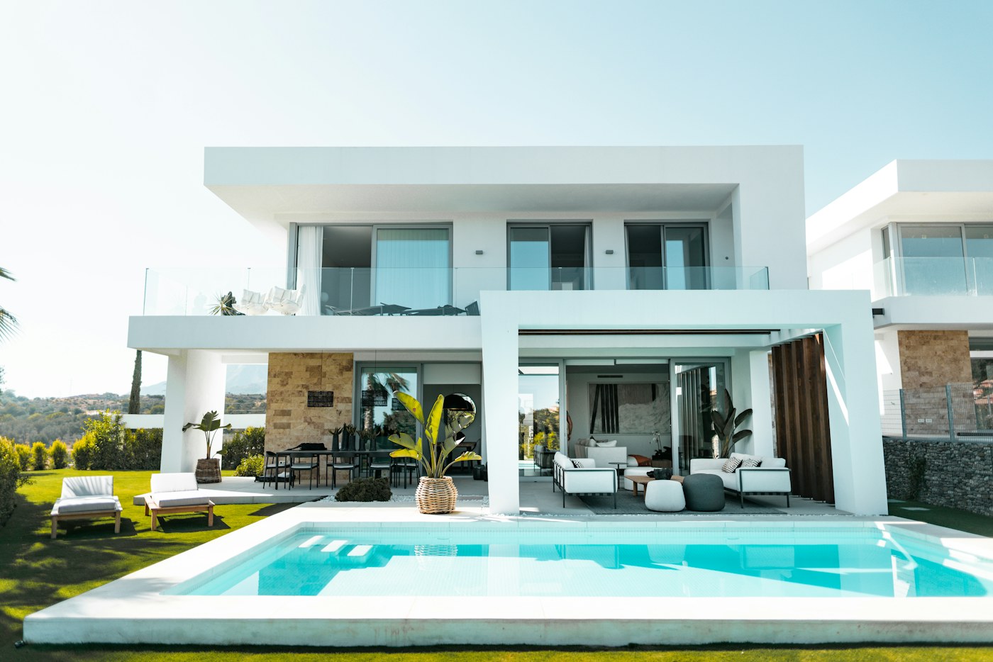White private villa opening onto its own lap pool