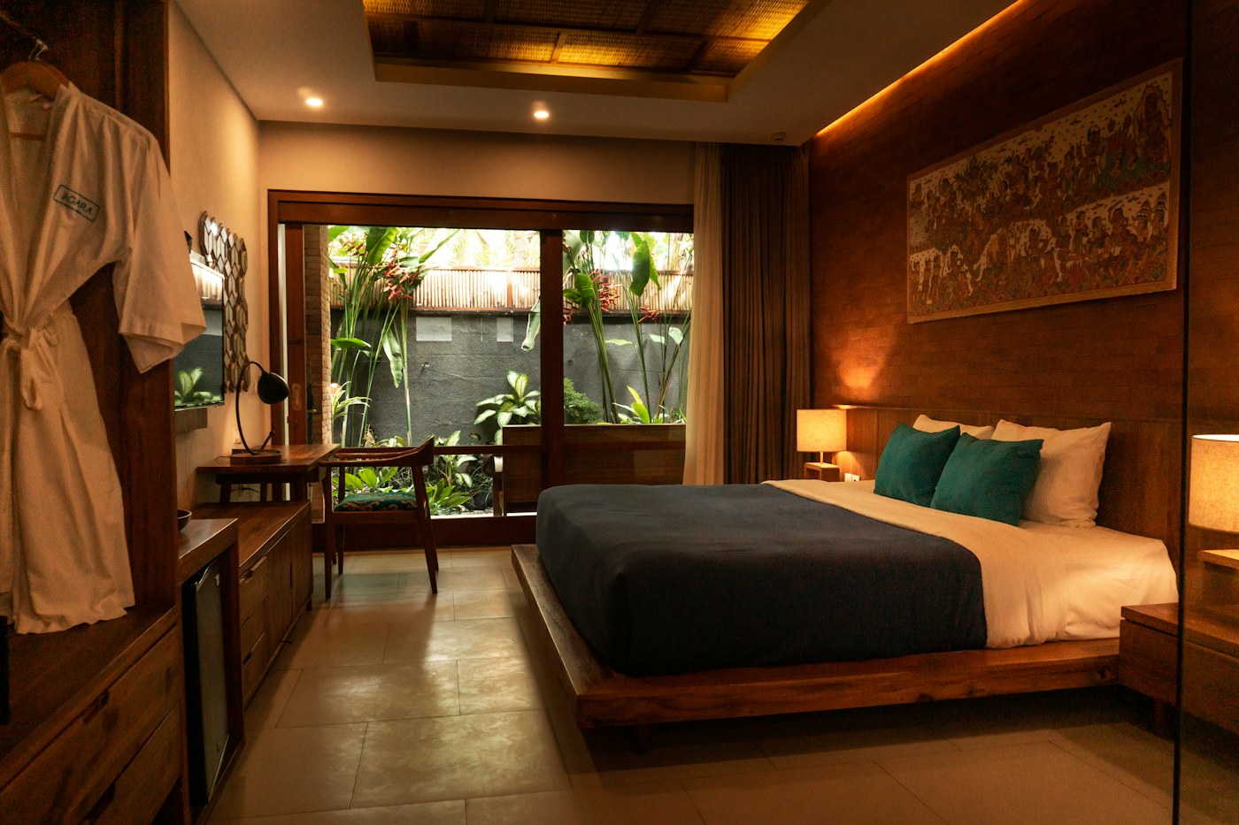 Private villa bedroom with restful natural textures and a quiet, intimate feel